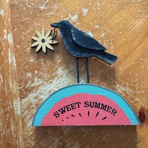 Decorative crow on sweet summer slice of watermelon